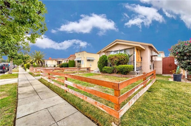 view of side of home with a lawn