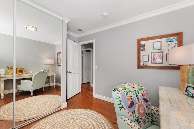 home office featuring ornamental molding and hardwood / wood-style floors