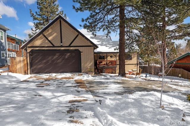 view of front of house featuring a garage and a deck