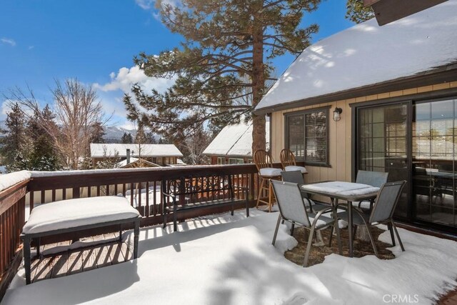 view of snow covered deck