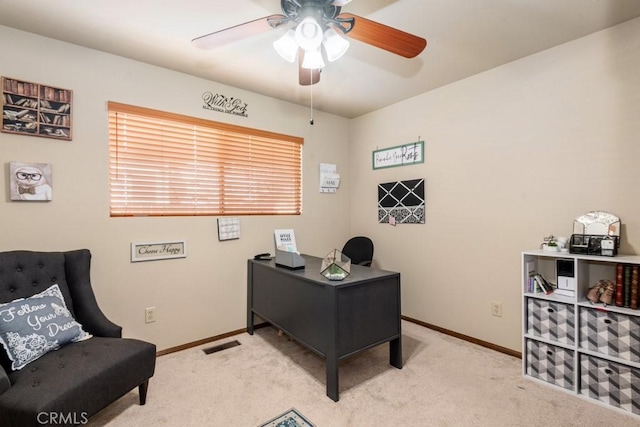 office area featuring light colored carpet and ceiling fan