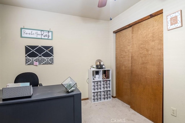 office with light carpet and ceiling fan