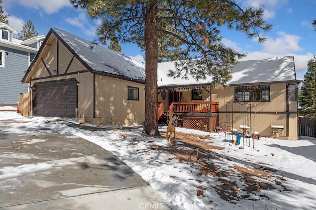 exterior space with a garage and a deck