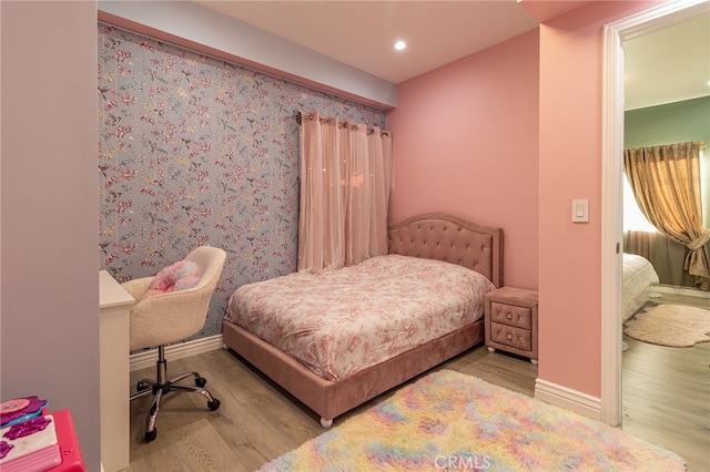 bedroom with light hardwood / wood-style floors