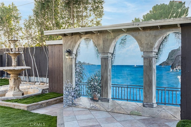 view of patio / terrace featuring fence