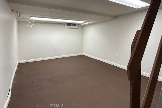 finished basement with visible vents and baseboards