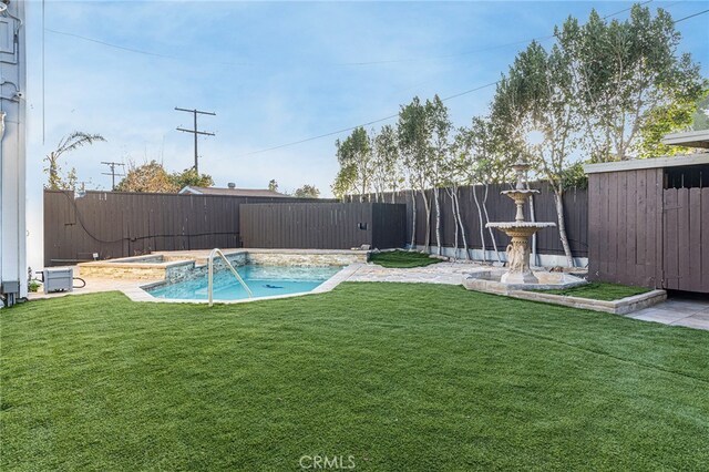 view of yard with a fenced in pool