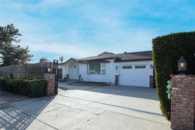 ranch-style home featuring a garage