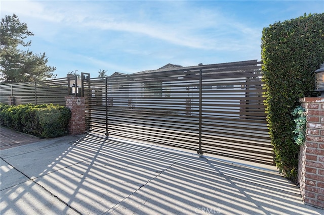 view of gate featuring fence