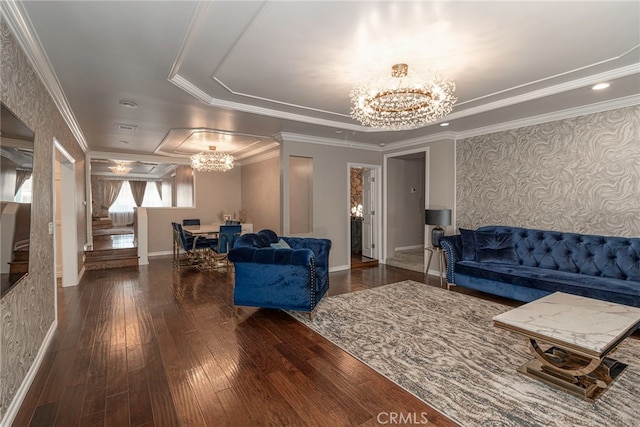 living area featuring crown molding, a notable chandelier, hardwood / wood-style floors, baseboards, and wallpapered walls