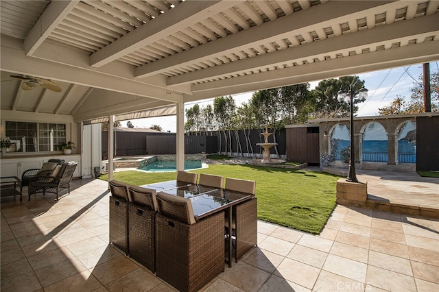 view of patio with a fenced backyard and a pool with connected hot tub