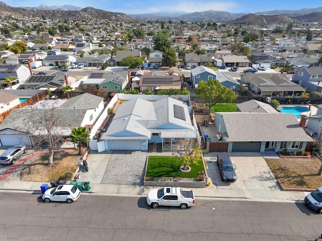 birds eye view of property featuring a mountain view