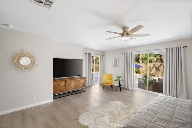 bedroom with ceiling fan, access to outside, and light wood-type flooring