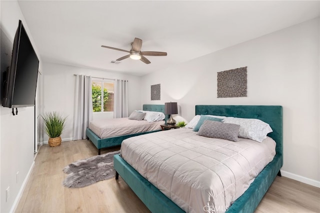 bedroom featuring ceiling fan and hardwood / wood-style floors