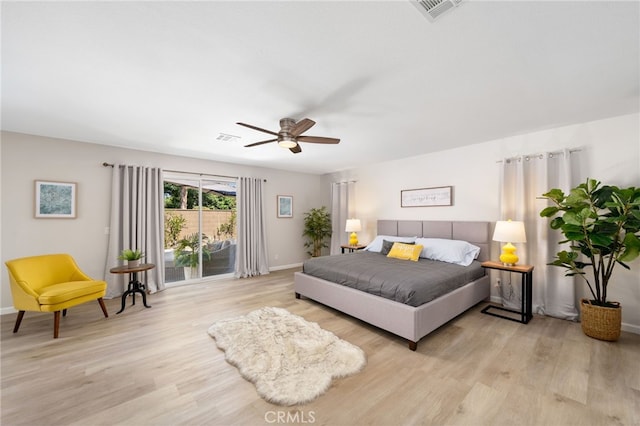 bedroom with access to exterior, light hardwood / wood-style flooring, and ceiling fan