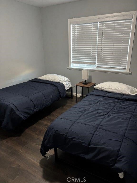 bedroom featuring dark hardwood / wood-style flooring