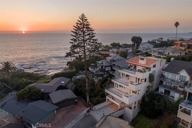 aerial view at dusk with a water view