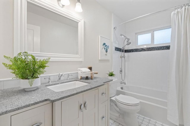 full bathroom featuring vanity, shower / tub combo, and toilet