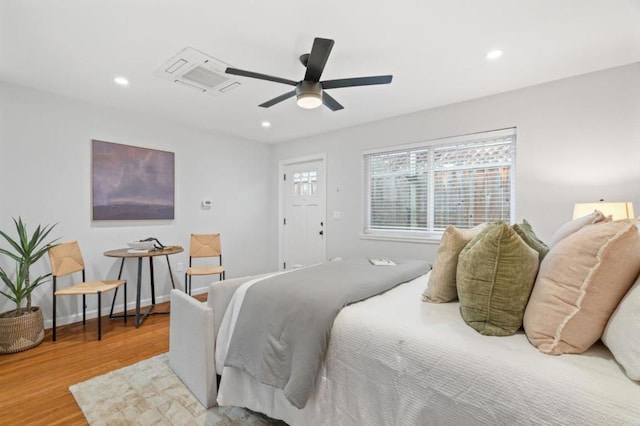 bedroom featuring ceiling fan and hardwood / wood-style floors