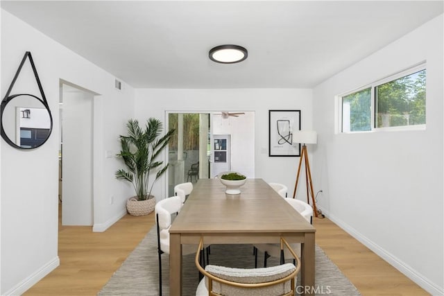 dining space featuring light hardwood / wood-style flooring