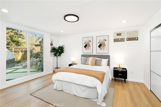 bedroom with light hardwood / wood-style flooring