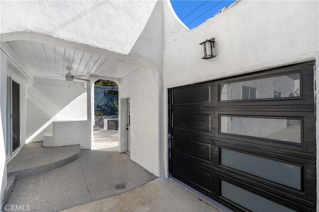 doorway to property featuring ceiling fan