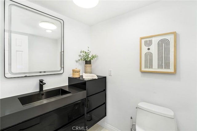 bathroom with vanity and toilet