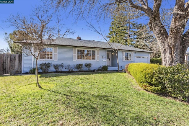 single story home featuring a garage and a front lawn