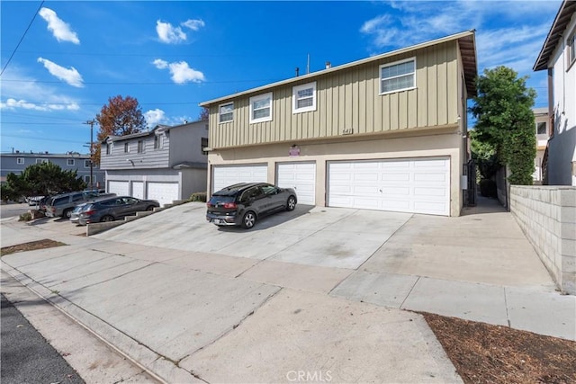 front facade with a garage