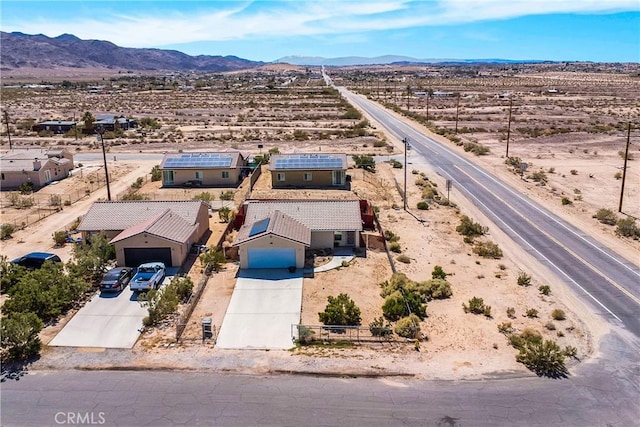 birds eye view of property featuring a mountain view