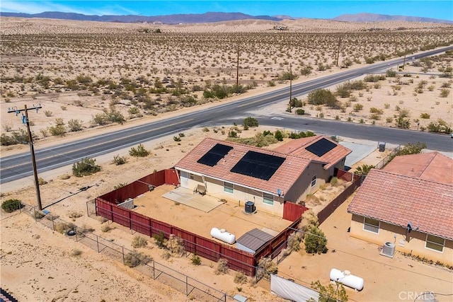 birds eye view of property featuring a mountain view