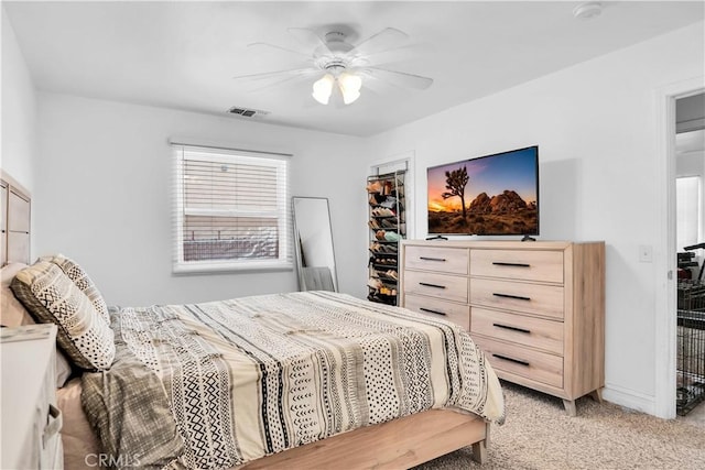 carpeted bedroom featuring ceiling fan