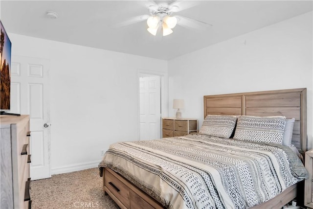 bedroom featuring light colored carpet and ceiling fan