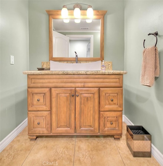 bathroom with vanity and tile patterned flooring