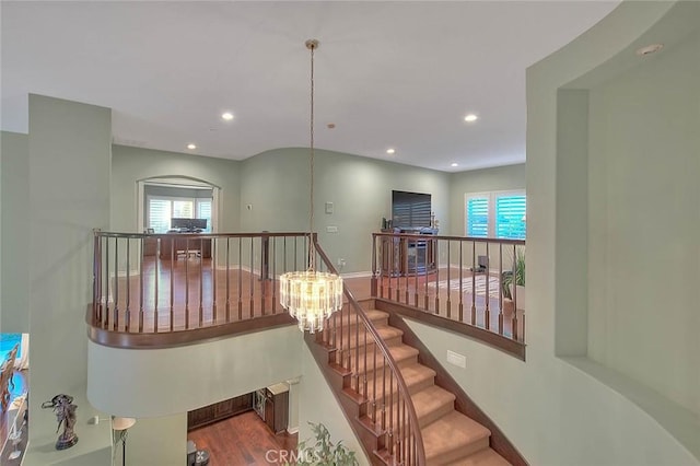 corridor featuring hardwood / wood-style floors and a wealth of natural light