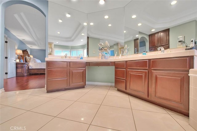 bathroom with tile patterned flooring and vanity