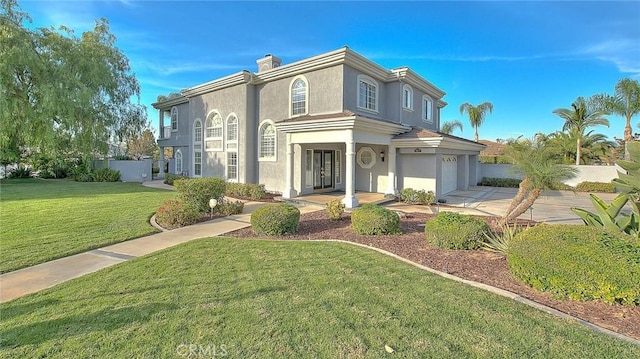 view of front of home featuring a garage and a front yard