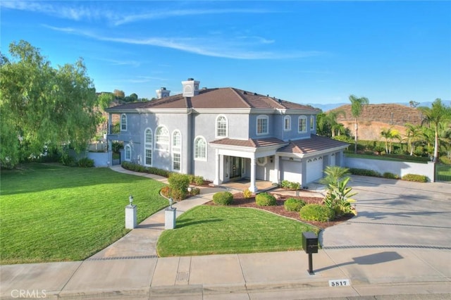 view of front facade featuring a garage and a front yard