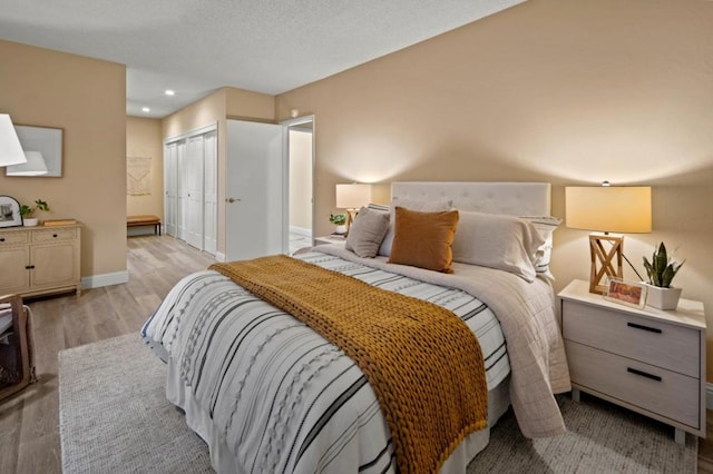 bedroom featuring light hardwood / wood-style flooring and a closet