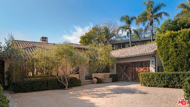 mediterranean / spanish-style house featuring a garage