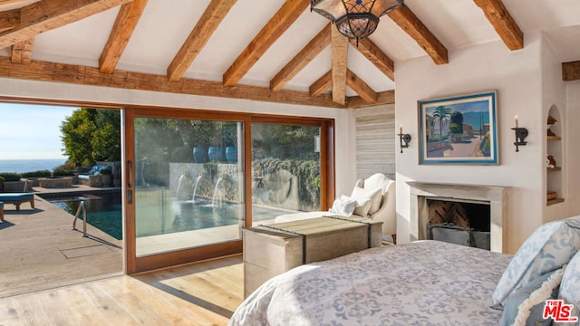 bedroom featuring vaulted ceiling with beams, light hardwood / wood-style floors, multiple windows, and access to outside