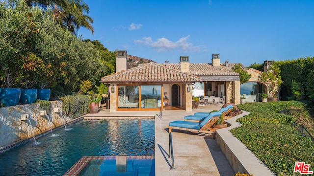 view of swimming pool featuring a patio area