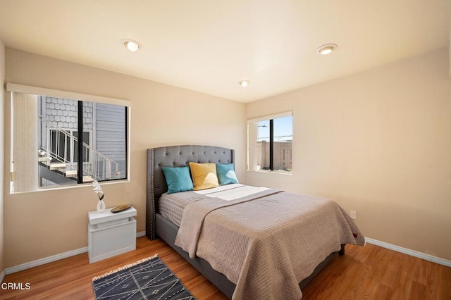 bedroom with hardwood / wood-style flooring