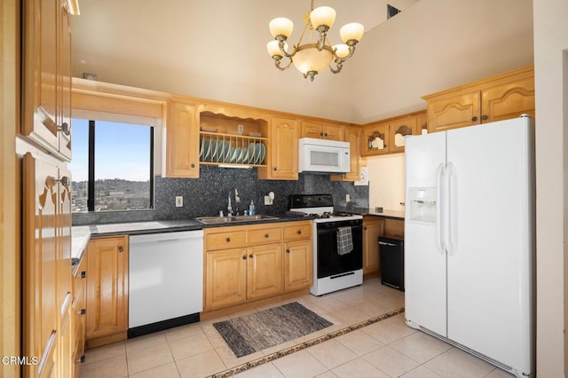 1121 E Wilson Ave Unit 12, Glendale, CA 91206 - kitchen with white appliances, dark countertops, light tile patterned flooring, backsplash, and a towering ceiling