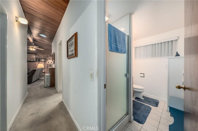 corridor with wooden ceiling and light tile patterned floors