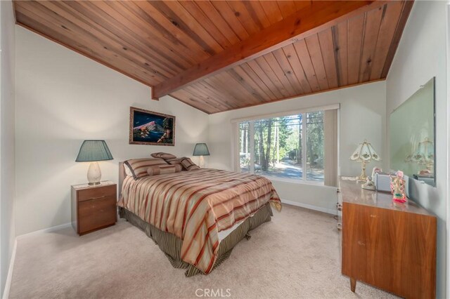 bedroom with light carpet, vaulted ceiling with beams, and wood ceiling