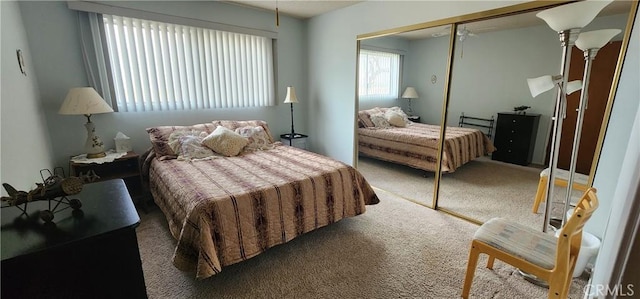 carpeted bedroom featuring a closet