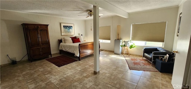 tiled bedroom featuring ceiling fan and a textured ceiling