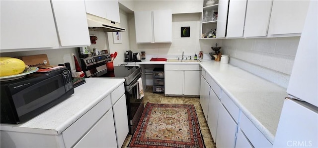 kitchen featuring white cabinetry, sink, backsplash, white refrigerator, and electric range