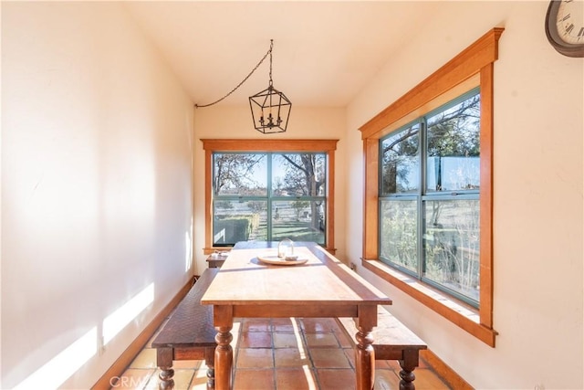 dining area featuring an inviting chandelier